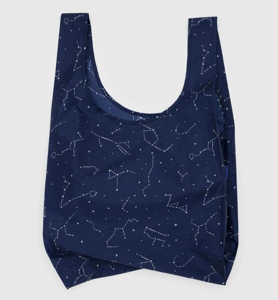 Navy reusable BAGGU bag with white constellation pattern and blue logo tag